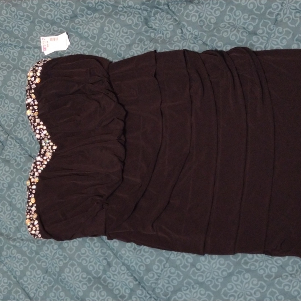 Black strapless dress with bejeweled neckline